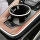 Illustration for article titled The Needlessly Complicated Cupholders in the Porsche 911 Are Awesome